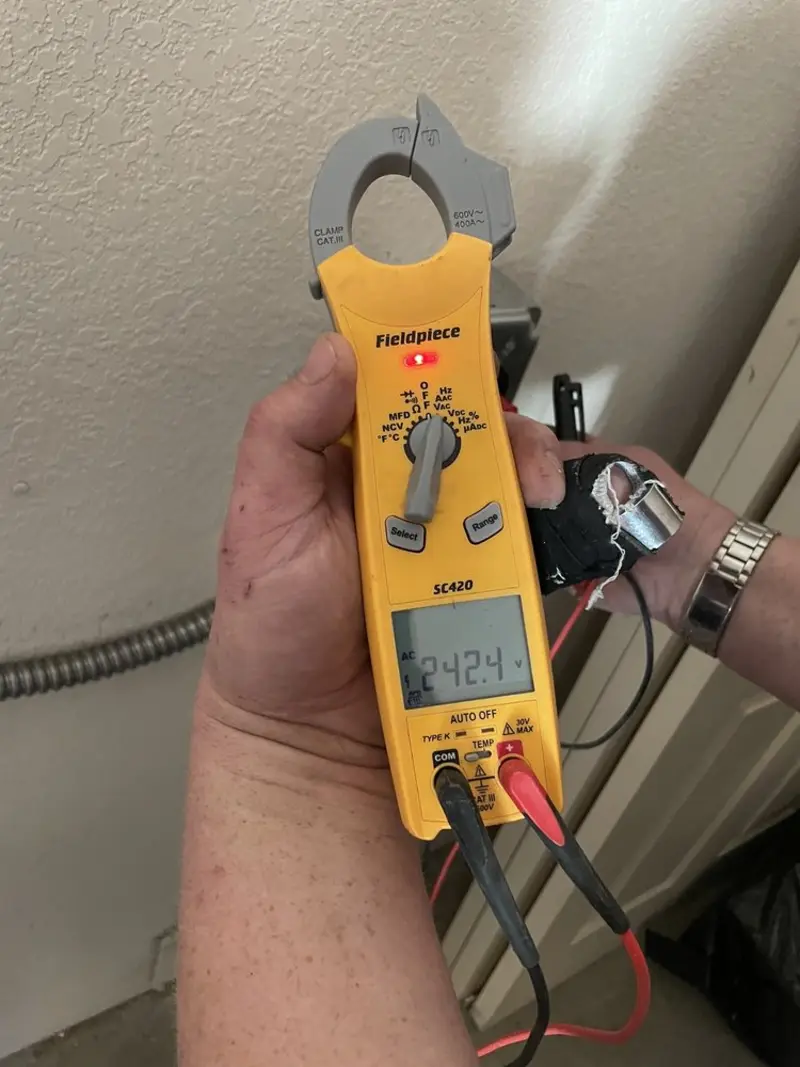 Voltage testing with clamp meter during Ceiling Fan Installation in Alpine